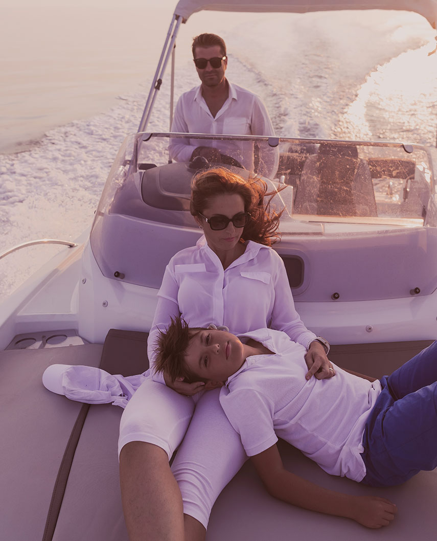 Family relaxing on a boat underway